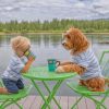 Boy Drinking Coffee With His Puppy Pa